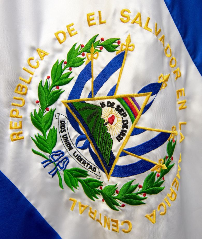 The flag of El  Salvador is seen on July 25, 2014, during a press conference at the El Salvador Embassy in Washington.    AFP PHOTO/Paul J. Richards        (Photo credit should read PAUL J. RICHARDS/AFP/Getty Images)