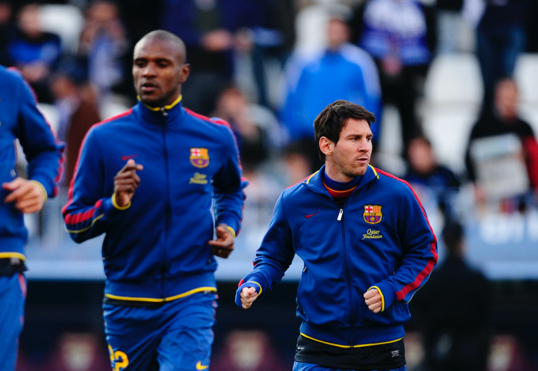 Lionel Messi junto a Eric Abidal