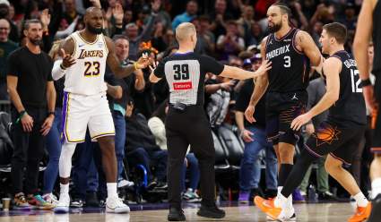 Dillon Brooks asiste al partido sentado detrás de la canasta para provocar a LeBron.